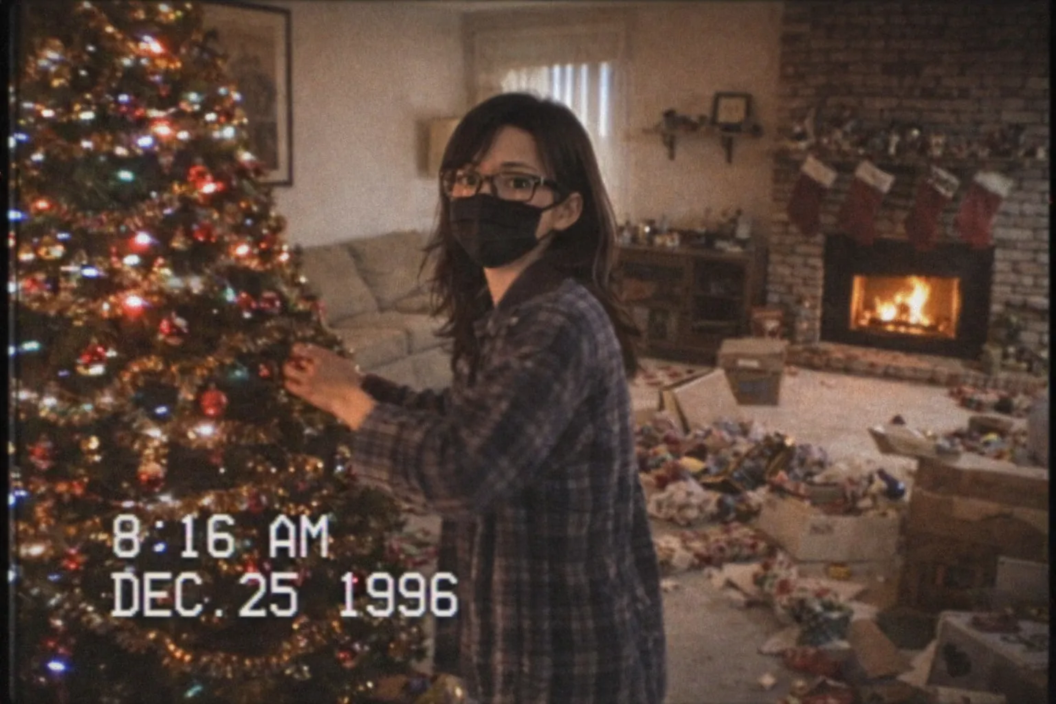 VHS-style Christmas morning scene with an adult decorating a Christmas tree in a cozy living room, filmed like a 1990s home camcorder with timestamp and nostalgic visual effects.